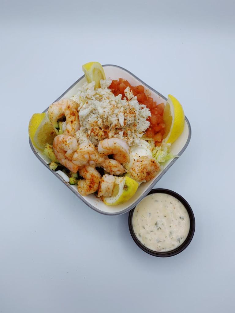 Crab and Shrimp Louie · Crab, shrimp, tomatoes, cucumbers and eggs served over iceburg lettuce and Louie dressing on side.