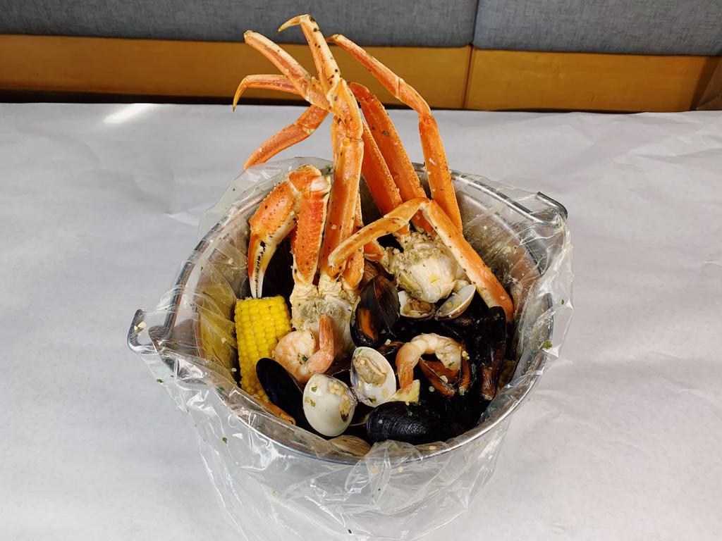 4 lb. Steamer Bucket · 1 lb. each of snow crab, shrimp, clams and mussels.