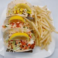 Tres Tacos  · Choice of fish grilled or fried, shrimp, salmon, chicken or beef. Served with pico de gallo,...