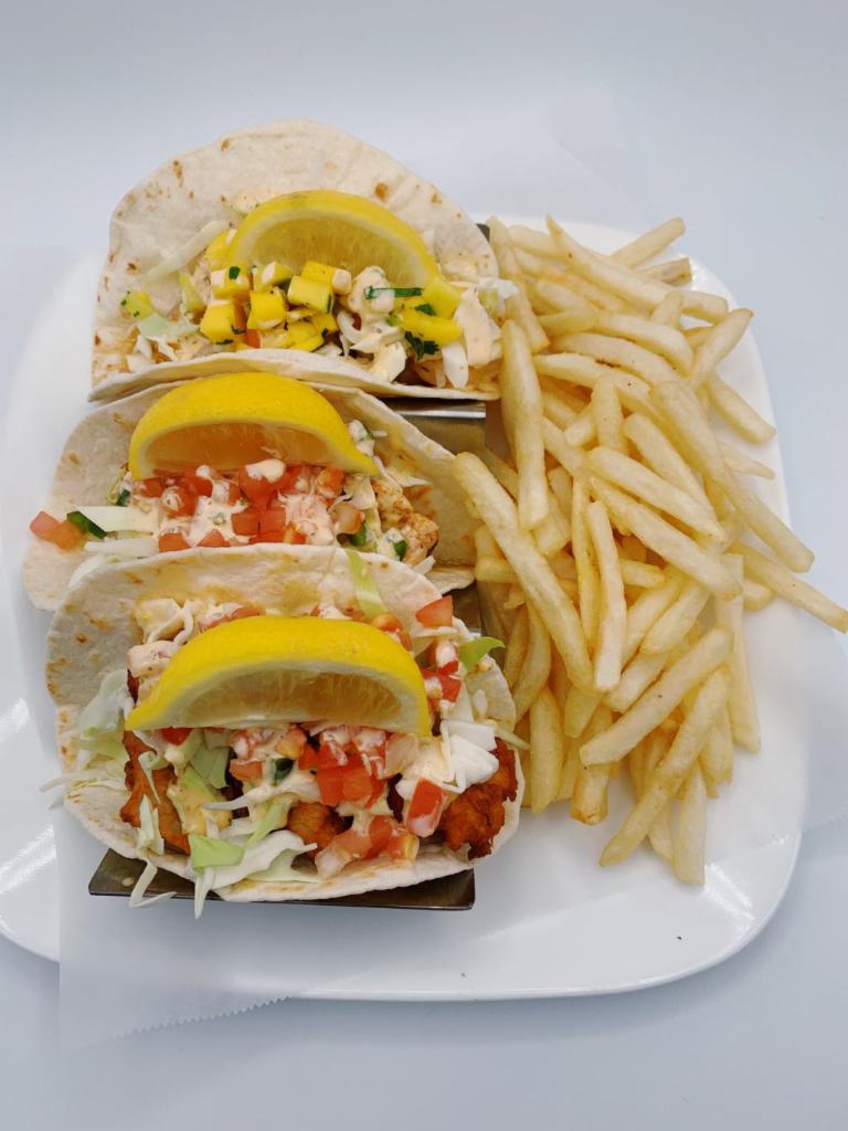 Tres Tacos  · Choice of fish grilled or fried, shrimp, salmon, chicken or beef. Served with pico de gallo, lettuce and spicy ranch. Shrimp taco comes with mango salsa instead of pico de gallo. Served with fries or substitute fries for side item $4.99