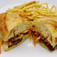 Banh Mi Bulgogi Beef · Served with pickled daikon and carrots, sliced jalapenos, onions, cilantro and topped with a...