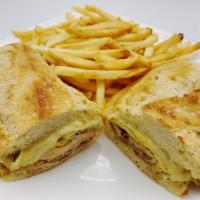Cuban Sandwich  · Grilled marinated pork, grilled sliced ham, sliced pickles, Swiss cheese and spicy mustard o...
