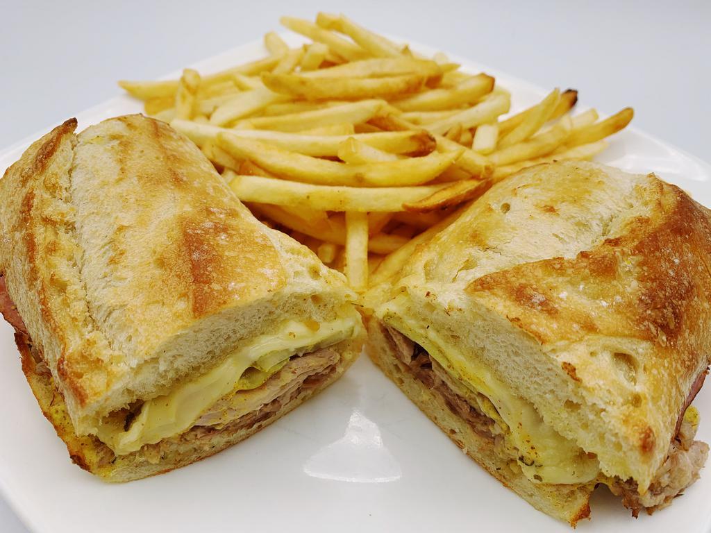 Cuban Sandwich  · Grilled marinated pork, grilled sliced ham, sliced pickles, Swiss cheese and spicy mustard on a fresh French baguette. Served with fries or substitute fries with side item $4.99