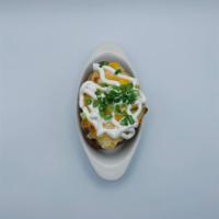 Baked Potato · Loaded with butter, cheddar cheese, sour cream, chives and bacon.