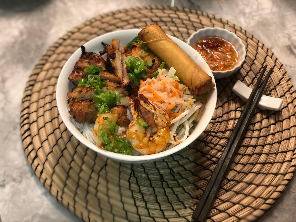 1. Bun shrimp, grilled meat, egg roll · Grilled large size shrimps, egg roll, and choice of grilled meat (chicken, beef or pork). Rice vermicelli noodles served with lettuce, cucumbers, bean sprouts, sour carrots, sour radishes and peanuts with house special fish sauce. Vermicelli noodles are gluten free.