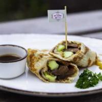 Duck Roll · Cooked marinated duck, cucumber and scallion wrap in roti wrapper.