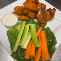 Wings · 8 wings deep fried and served with blue cheese, carrots, and celery.