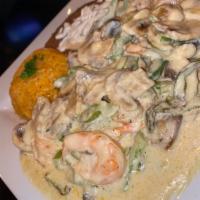 Crema Shrimp and Seafood · Sauteed shrimp, onions, green peppers, and mushrooms in a garlic cream butter sauce.