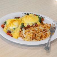 California Benedict · Grilled sour dough bread topped with two fried eggs, all-natural grilled turkey, bacon, dice...