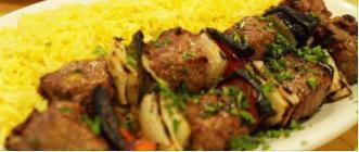 Beef Kabob · Two Skewers marinated Beef Tender Served with Rice, Salad, Onion, Hummus and Pita bread