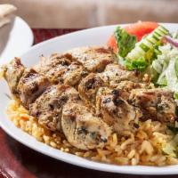 Chicken Skewers Dinner · Souvlaki. 3 char-grilled chicken skewers over rice with a side Greek salad.