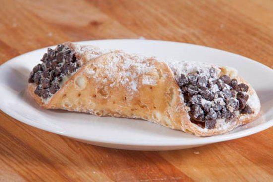 Connoli · A crispy pastry shell filled with creamy ricotta cheese and a chocolate chip blend.