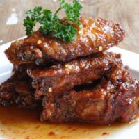 Spicy Wings · Fried chicken wings sauteed with sweet chili sauce. Spicy. 
