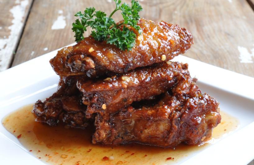Spicy Wings · Fried chicken wings sauteed with sweet chili sauce. Spicy. 