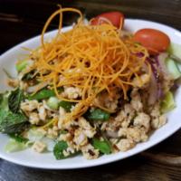 Larb Salad · Ground minced meat mixed with roast rice powder, red onions, chili lime juice, mint, scallio...