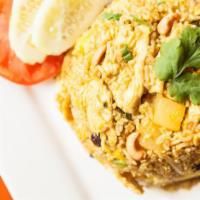 Pineapple Fried Rice · Stir-fried rice with egg, pineapple, raisins, onion, roasted cashew nuts, light curry powder.