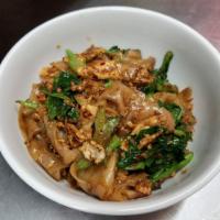 Pad See Ew · Your choice of protein with stir fried flat rice noodle, egg, broccoli and asian broccoli in...