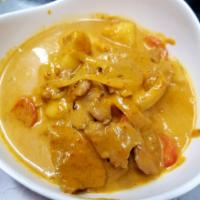 Yellow Curry · Yellow curry powder and coconut milk, potato, tomato, and onion. Spicy.