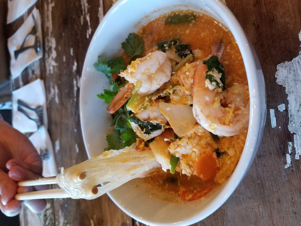 Thai Sukiyaki · Thai style Sukiyaki soup with Vermicelli noodle (Glass noodle), egg, napa, asian broccoli and scallion. Spicy (contained sesame seed and sesame oil)