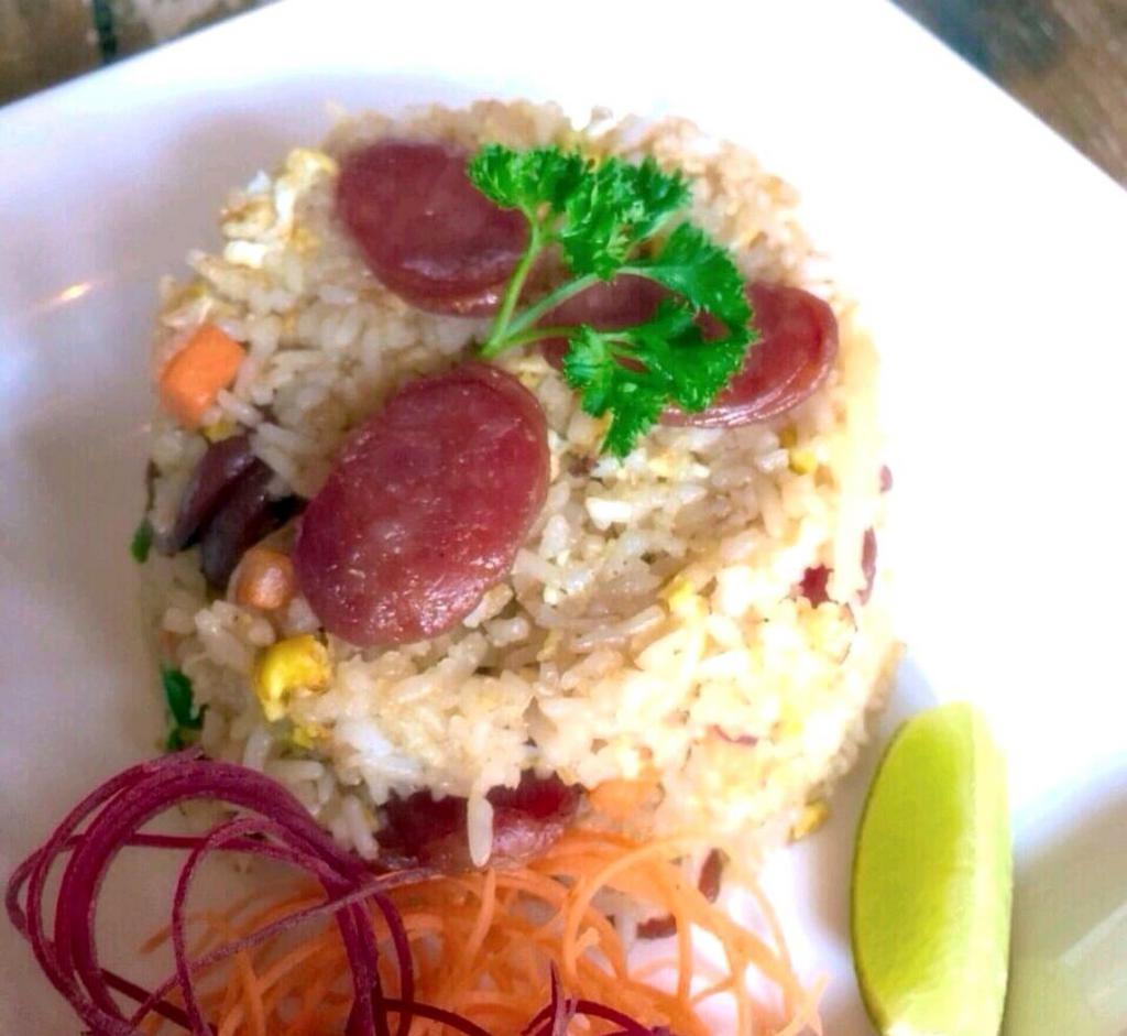 Thai Sausage Fried Rice · Stir-fried rice with Thai sausage, egg, onions, carrots, and scallions.