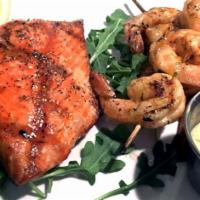 Seafood Duo · Grilled wild sockeye salmon with your choice of grilled octopus leg or grilled shrimp skewer...