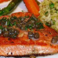 Mediterranean Style Salmon Dinner · Grilled wild sockeye salmon topped with lemon-caper sauce. Served with Green or green bean s...