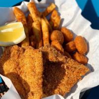 Catfish Basket · 2 Catfish filet coated in our blend of Cajun spiced cornmeal and fried till golden brown. Se...