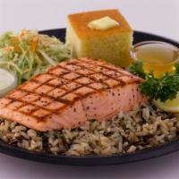 Grilled Wild Salmon · Alaskan salmon fillet served with wild rice, coleslaw, and cornbread. 