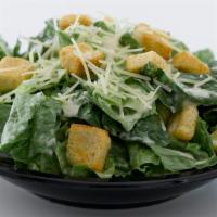 Caesar Salad · Entree portion with croutons, cheese and Caesar dressing.