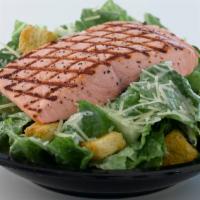 Grilled Salmon Caesar Salad · Grilled wild Alaska fillet served on side of Caesar salad with croutons, cheeses and Caesar ...