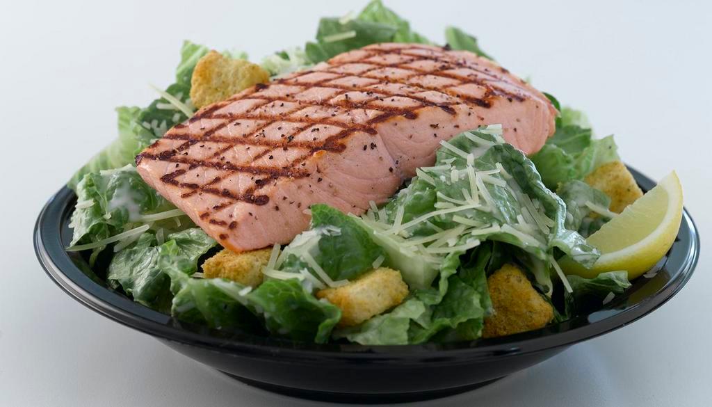Grilled Salmon Caesar Salad · Grilled wild Alaska fillet served on side of Caesar salad with croutons, cheeses and Caesar dressing.