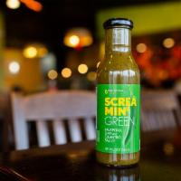 Bottle of Screamin' Green · A bottle of our vibrant green sauce that's bursting with lime cilantro flavor and finished o...