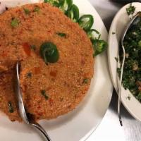 Tomato Kibbee · Vegetarian. A flavorful mix of tomatoes, cracked wheat, onions, olive oil, and spice natural...