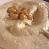 Hommous · Vegetarian. World-famous appetizer! A creamy bean dip made from chickpeas, tahini, lemon jui...
