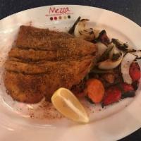 Seven Pepper Trout · Pan-seared rainbow trout topped with our special seven pepper recipe.