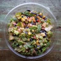 Chopped Southwest Salad · Chopped romaine, bacon, black beans, corn, avocado, and grape tomatoes with a pepper-lime dr...
