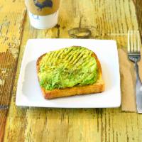 Avocado Toast · Fresh avocado, salt and pepper served on grilled table bread.