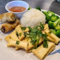 56.  Com dau hu chien, cha gio chay va bong cai · Steamed rice with fried tofu, fried veggie and tofu spring roll with broccoli. Sauce on the ...
