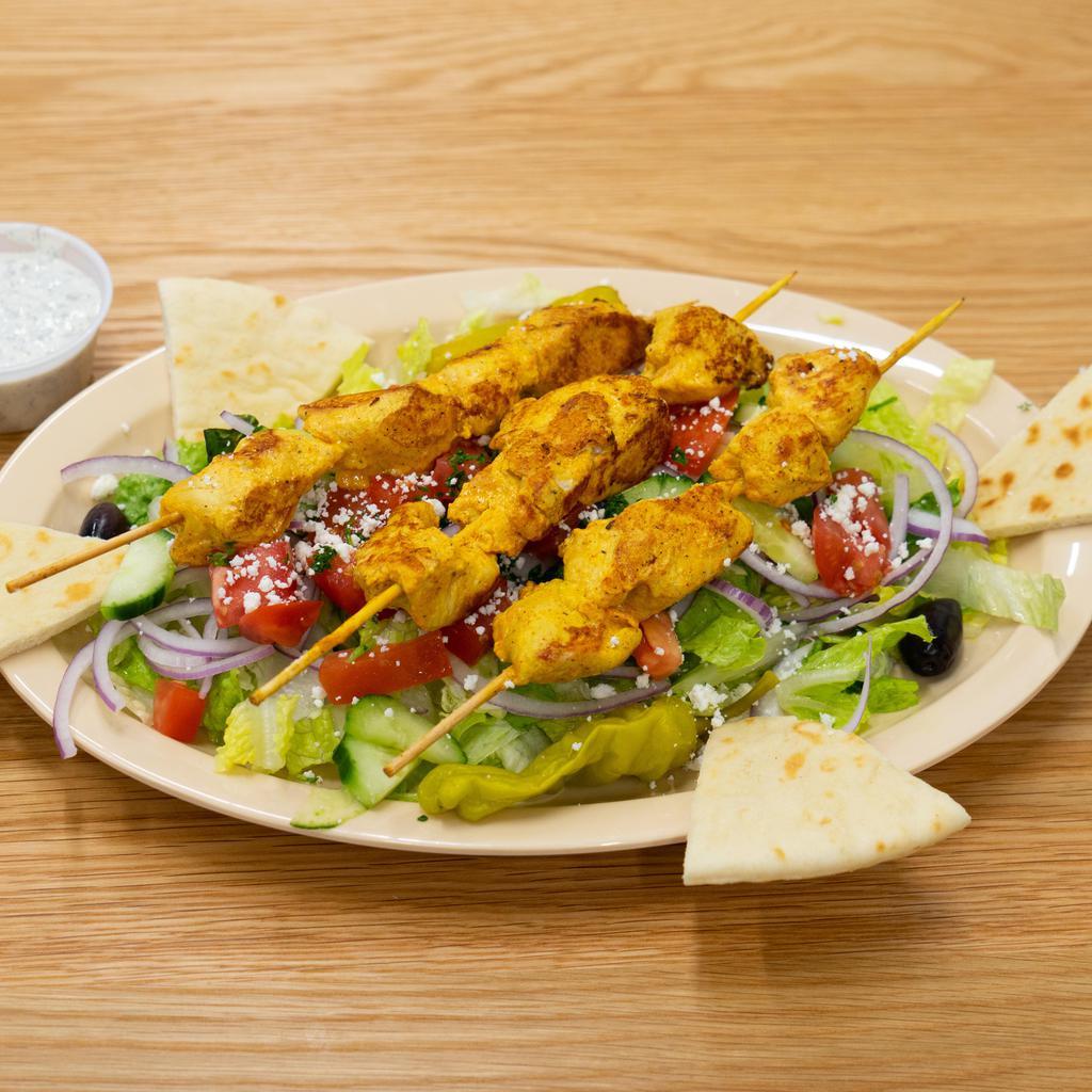 22. Chicken Shish Kabob Salad · Chicken shish kabob served with Greek salad, Kalamata olives, feta cheese, bread and tzatziki sauce or hummus.