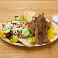 9. Lamb & Beef Gyros Plate · Lamb & beef gyros served with rice, Greek salad, pita bread & tzatziki sauce.
