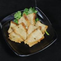 009. Pan-fried Fish Cake 煎魚餅 · 