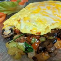 Garden Omelette · Green peppers, onions, tomatoes, spinach, mushrooms, and cheese.