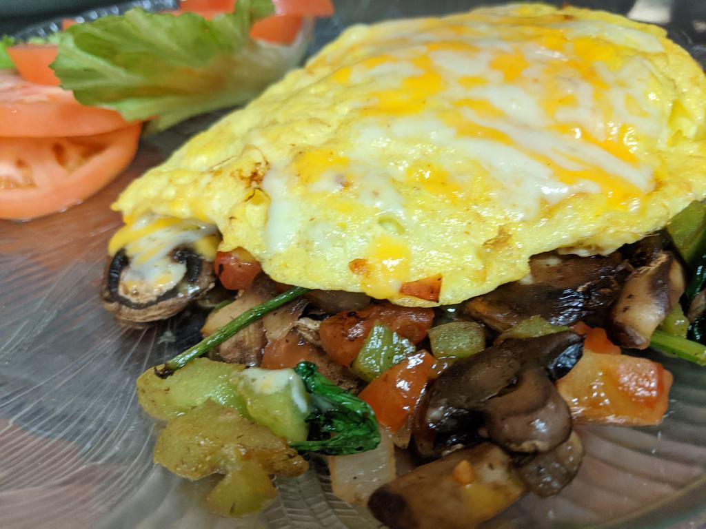Garden Omelette · Green peppers, onions, tomatoes, spinach, mushrooms, and cheese.