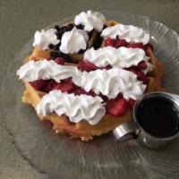 Stars and Stripes Waffle · Strawberry sauce, blueberries, and whipped cream.