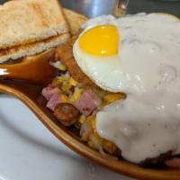 Meat Lovers Skillet · Chicken fried steak, bacon, sausage, ham and sausage gravy. Topped with 2 eggs, melted chees...
