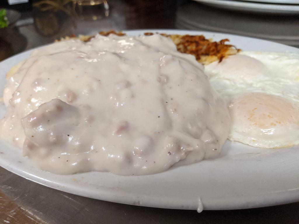 Biscuits & Sausage Gravy · Our own sausage gravy served over 2 biscuits with 2 eggs.