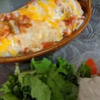 Sonora Burrito · Chorizo, eggs, green chilies, onions, salsa, cheese, garnished with tomatoes, lettuce, and s...