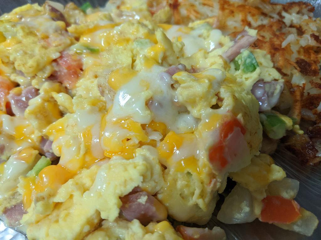 Western Scramble · Ham, onions, green peppers, tomatoes, cheese, and English muffin.
