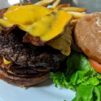 Big Daddy Burger · 1 lb. of stacked black Angus beef, topped with cheese and bacon.