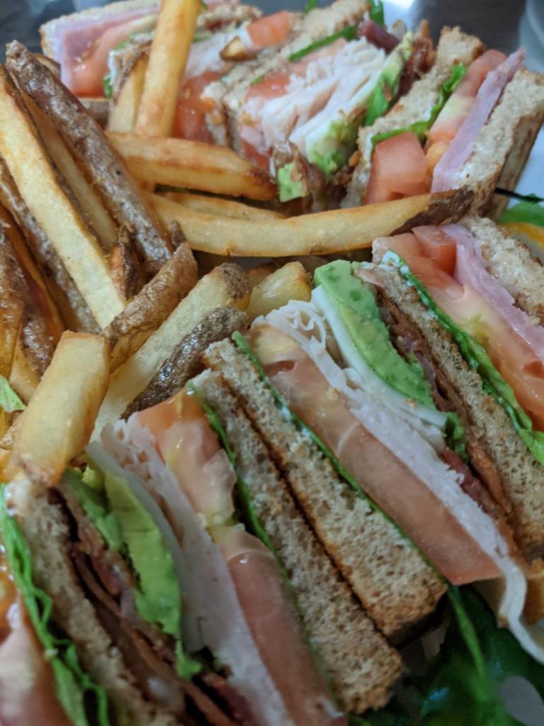 Club Sandwich · Turkey, ham, bacon, avocado, Jack cheese, mayonnaise, lettuce, tomatoes on toasted wheat.